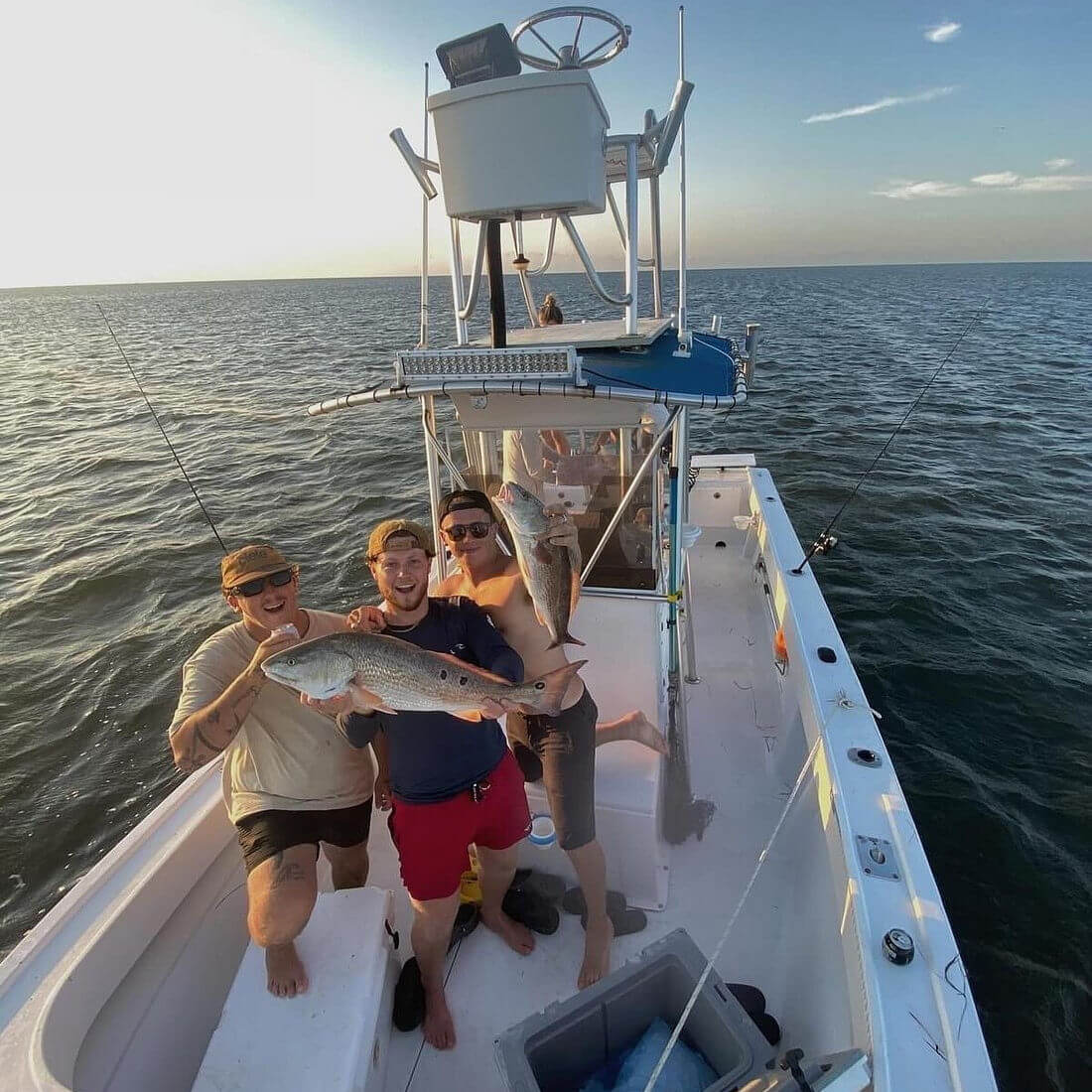 Angler holds up nice red drum.